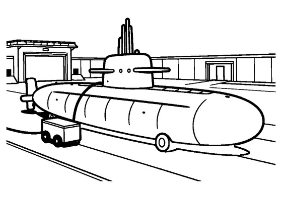 Um submarino está numa base seca perto de um carrinho e uma corda grossa.
