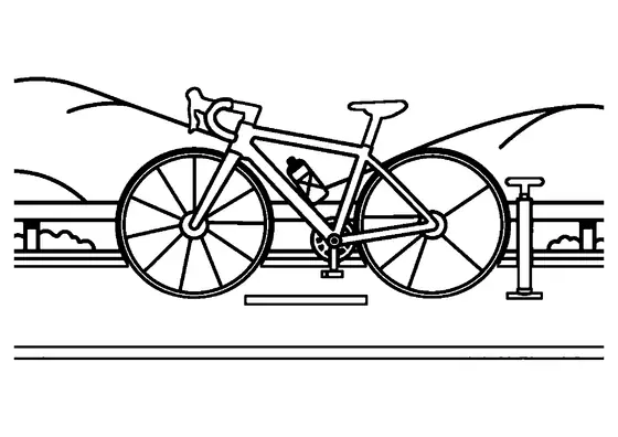 Una moderna bicicleta de carreras en el asfalto junto a la línea de meta de un circuito de ciclismo en ruta.