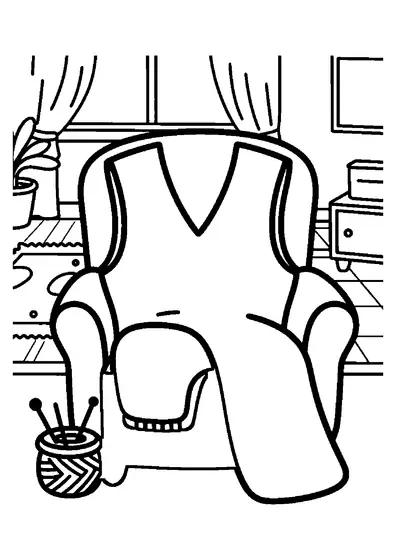 Un grand gilet confectionné à la main est posé sur un fauteuil, près d’un panier rempli de pelotes de laine.