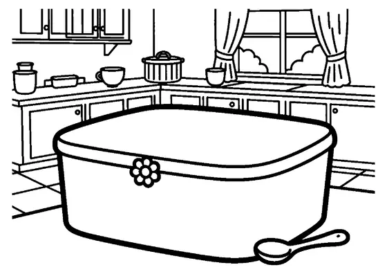 Uma caixa com divisórias está ao lado de uma chávena e uma colher numa cozinha clara.
