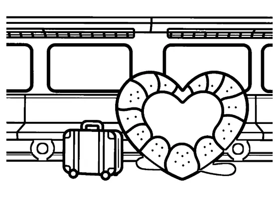 Coussin en forme de cœur posé sur un siège dans un compartiment de train.