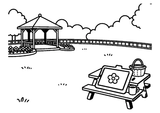 O tabletă care afișează desenul unei flori este așezată pe o masă de picnic din parc.